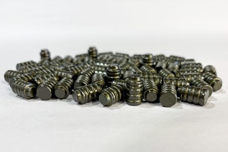 Small pile of 148 grain Button Nose Wadcutter Bevel Base coated in Hi-Tek Supercoat Texas Tea Original