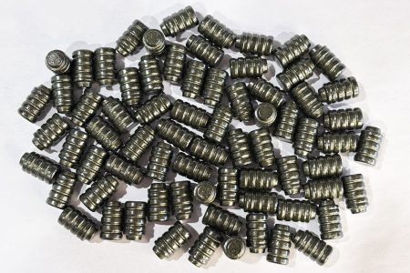 Small pile of 148 grain Button Nose Wadcutter Bevel Base coated in Hi-Tek Supercoat Texas Tea Original